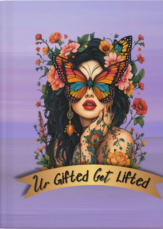 Notebook cover with a colorful design of a woman with a butterfly on her face, flowers, and text 'Ur Gifted Get Lifted' on a purple background.