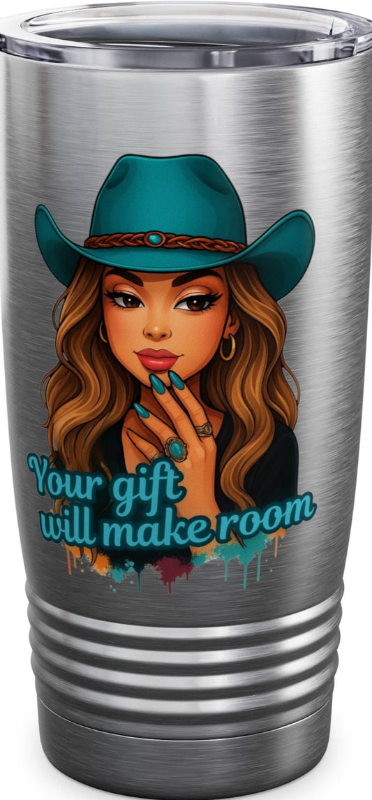 Silver tumbler with a graphic of a woman in a cowboy hat and motivational quote on a white background